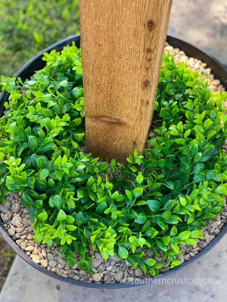 outdoor patio lighting & privacy diy wreath in barrel close up