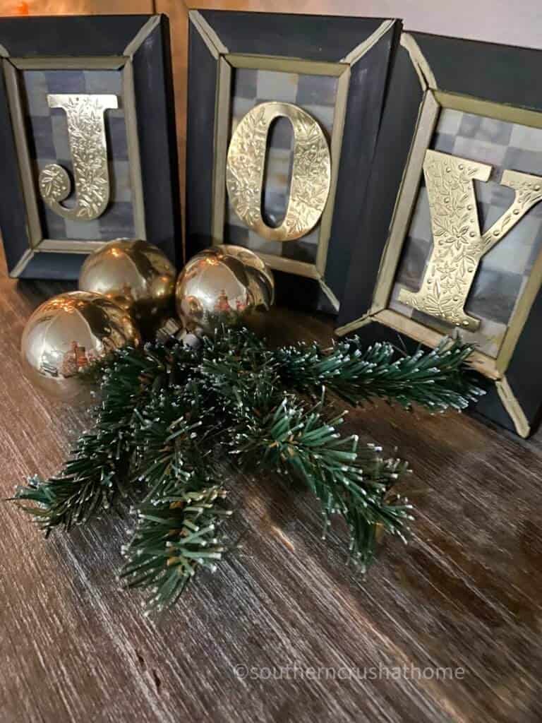 final display of JOY DIY with greenery and ornaments