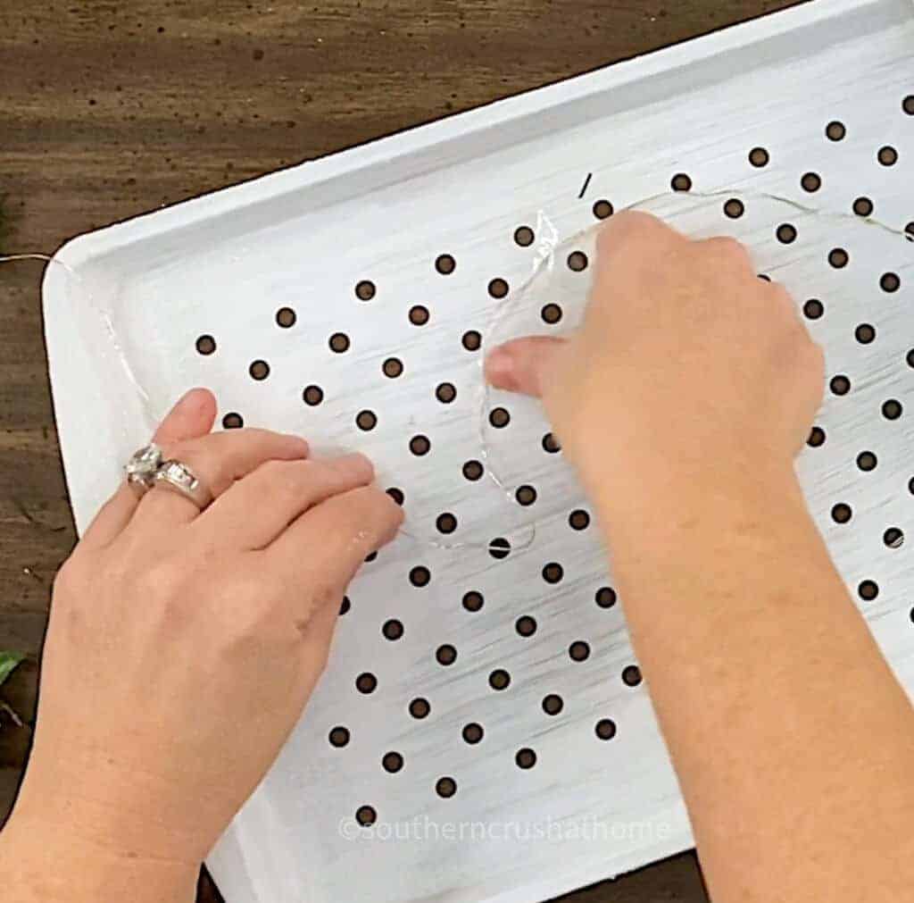 taping down christmas lights to grill pan