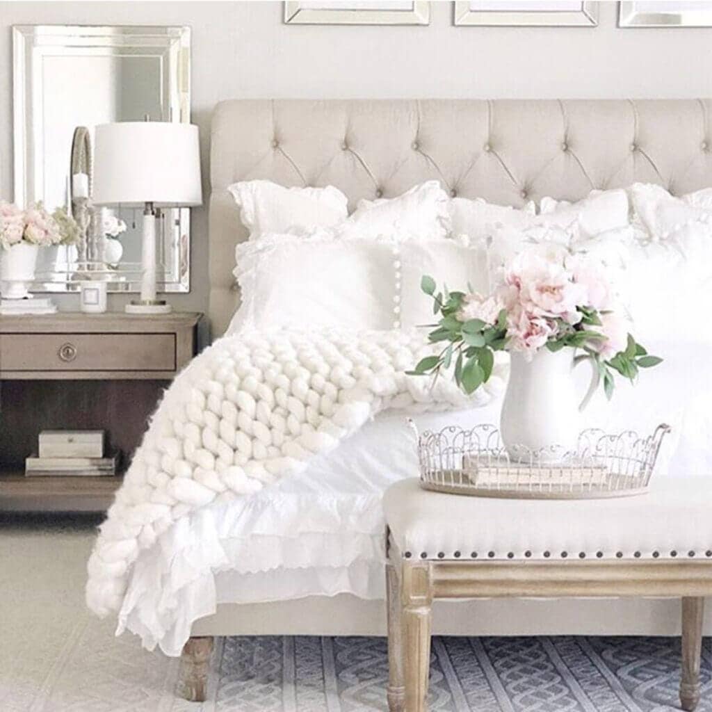 chunky knit throw white bedroom with pink flowers and bench