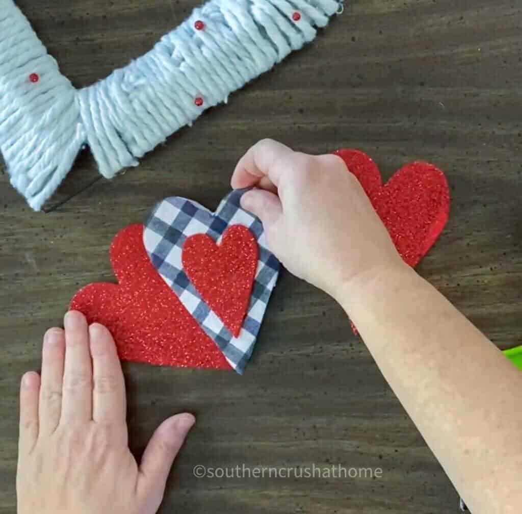 gluing felt hearts together