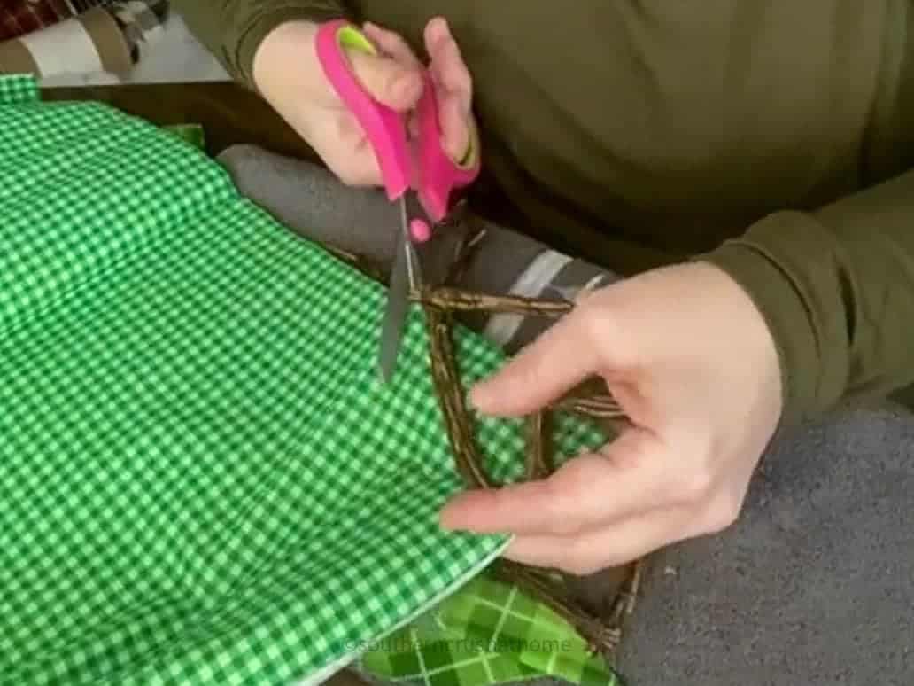 cutting out shamrock from fabric