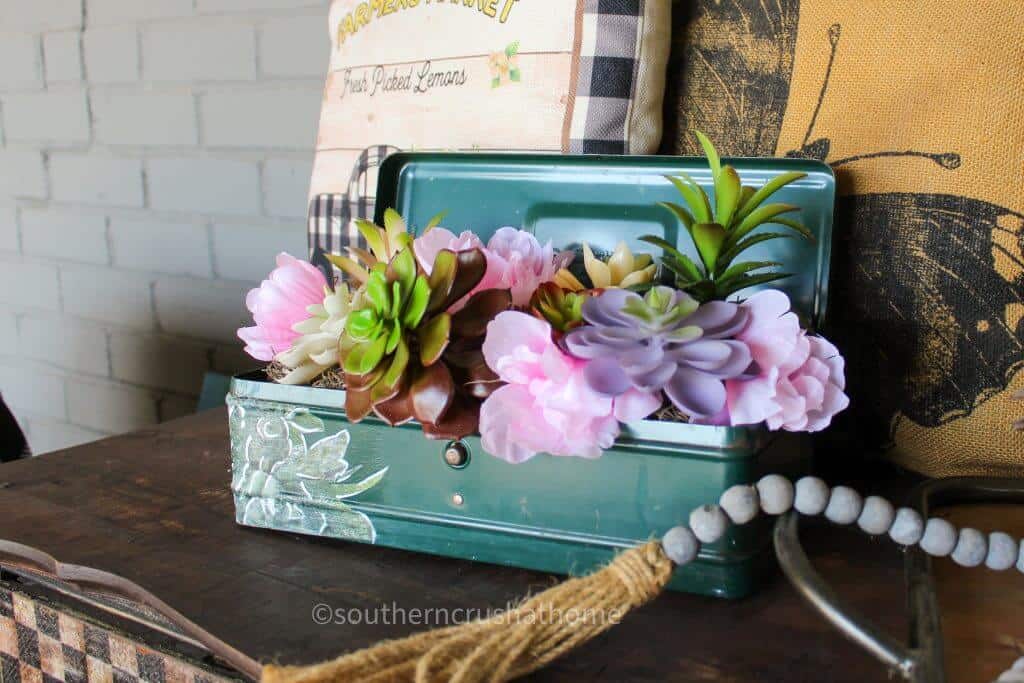 vintage tool box with silk flowers