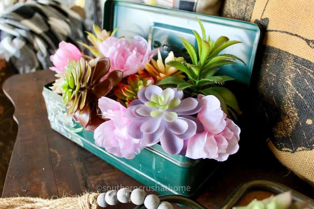 close up of vintage toolbox planter