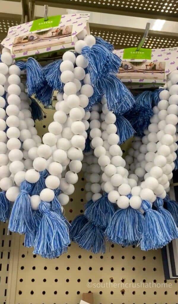 white wooden bead decor with blue tassels from hobby lobby