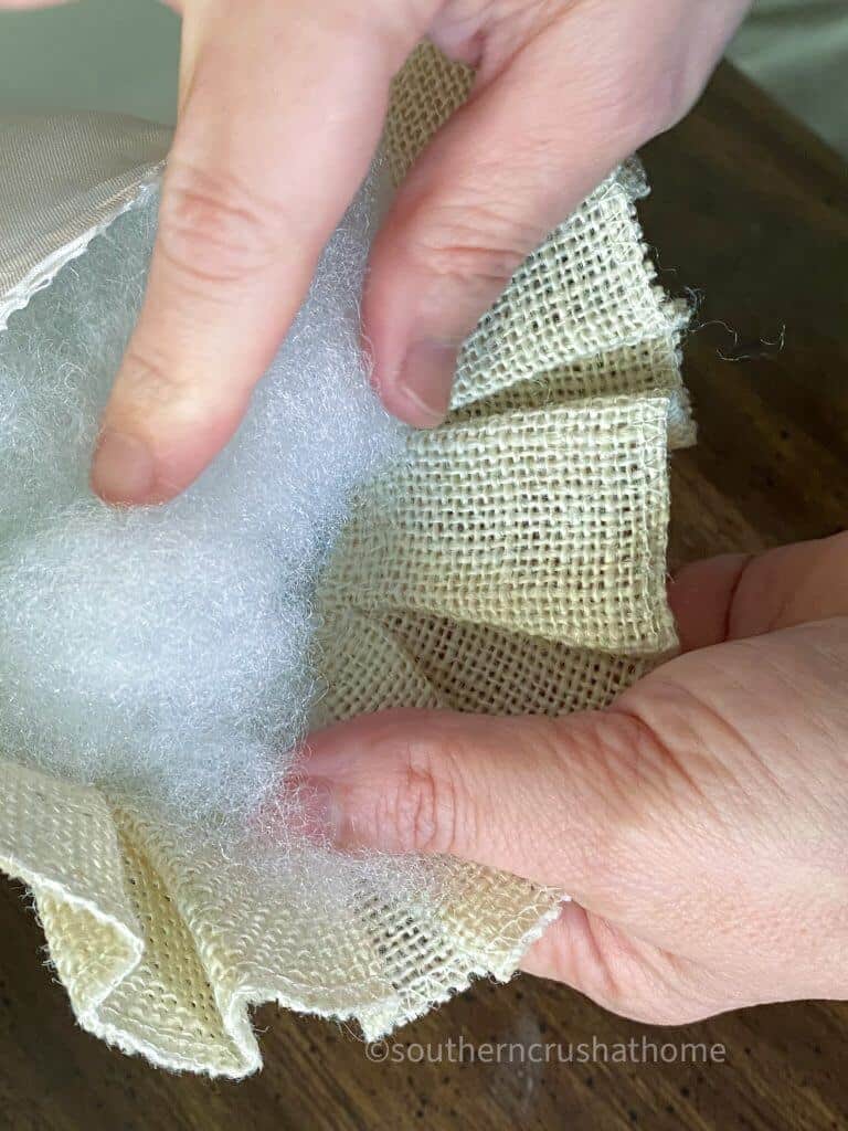 stuffing the polyfil into the pillow