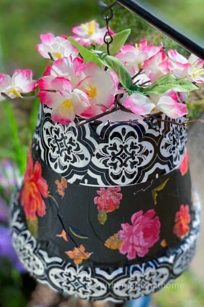 tissue paper and flowers on clay pot wind chime