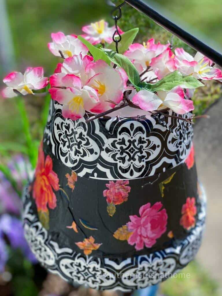 tissue paper and flowers on clay pot wind chime
