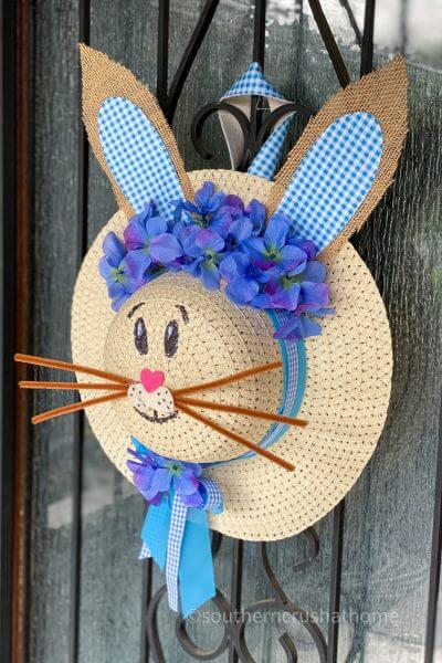 completed dollar tree sun hat bunny hat wreath on door