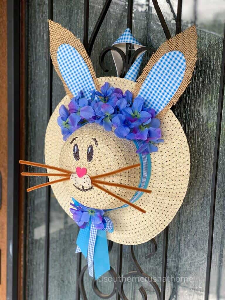 completed dollar tree sun hat bunny hat wreath on door