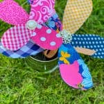 two kitchen whisk fabric flowers in yard