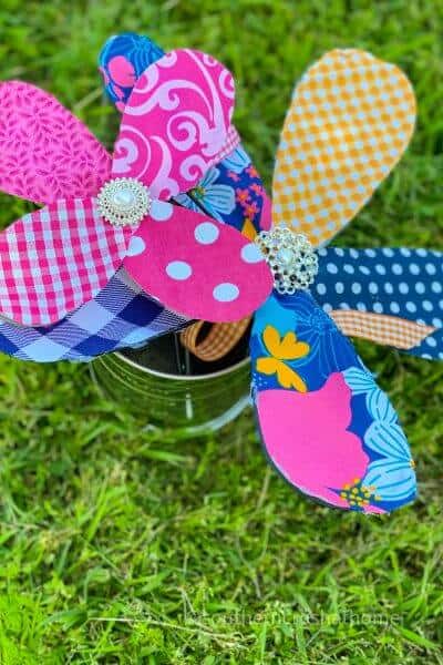 two kitchen whisk fabric flowers in yard