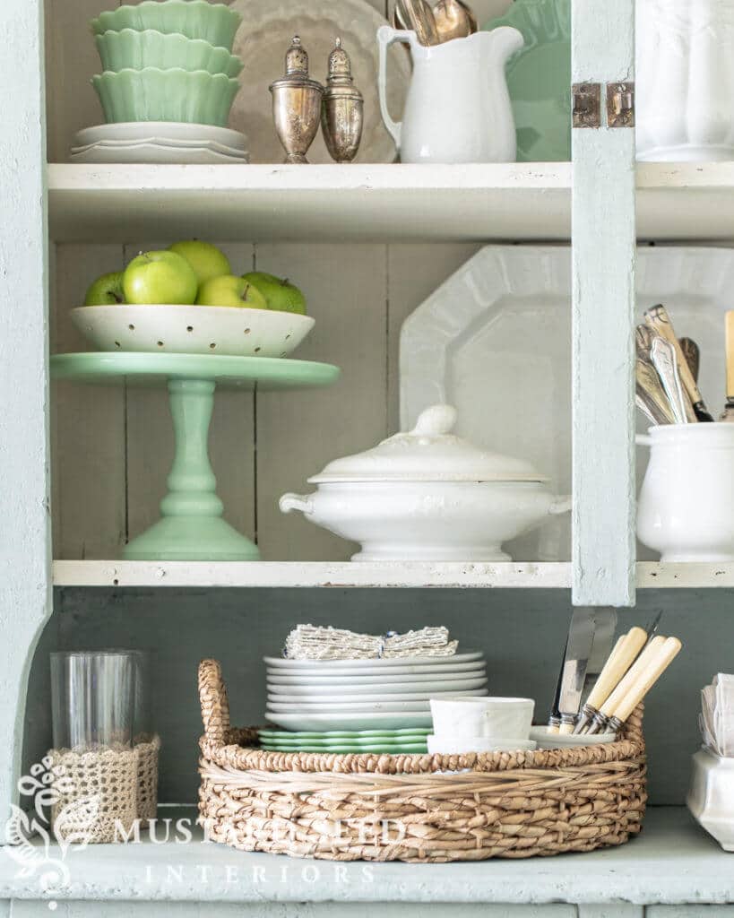 Kitchen hutch decorated with cake plates and ironstone