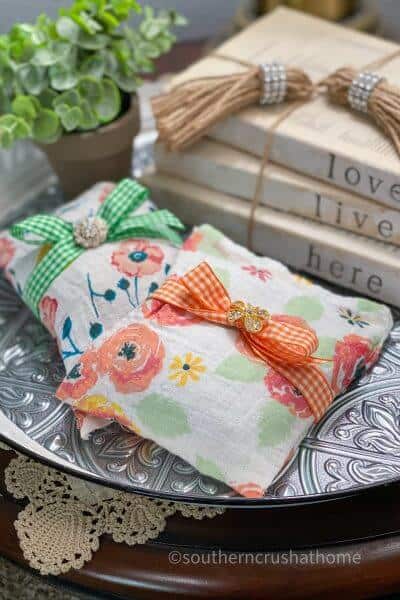 swaddle blanket muslin sachets styled on tray