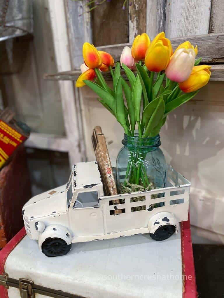 shabby chic farmhouse cream colored truck with faux tulips