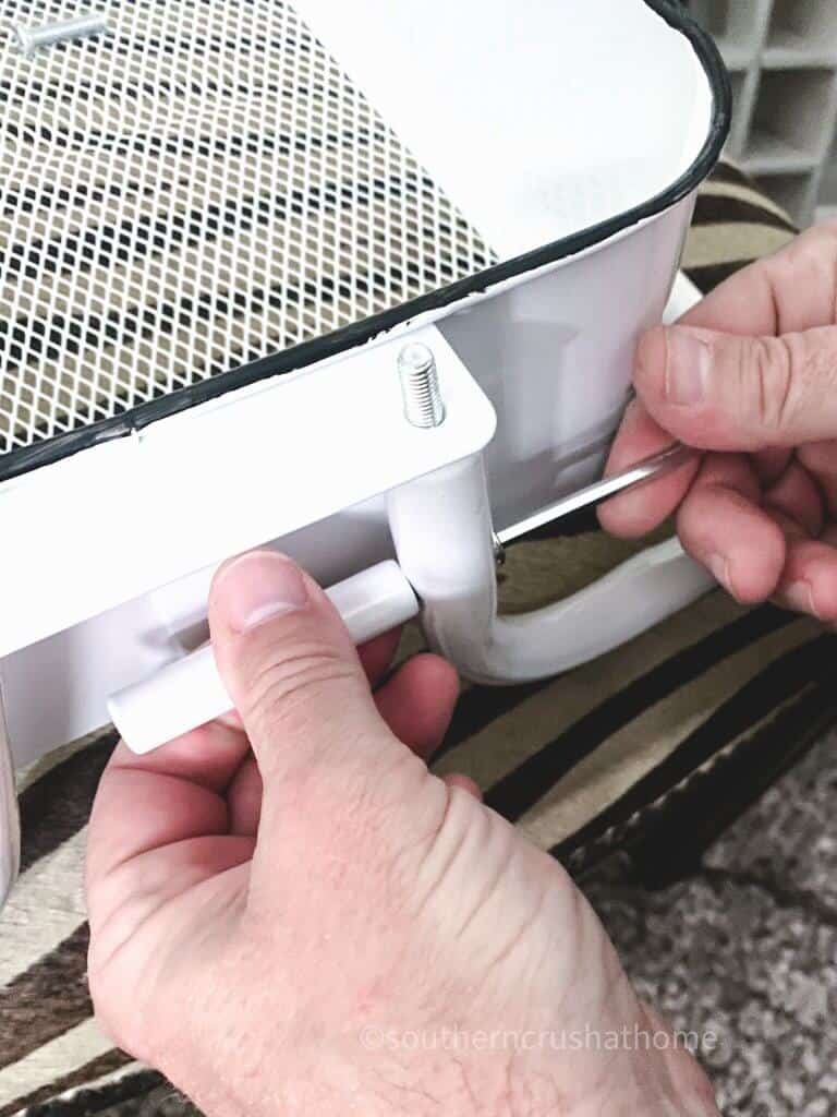 putting screws in beverage cart
