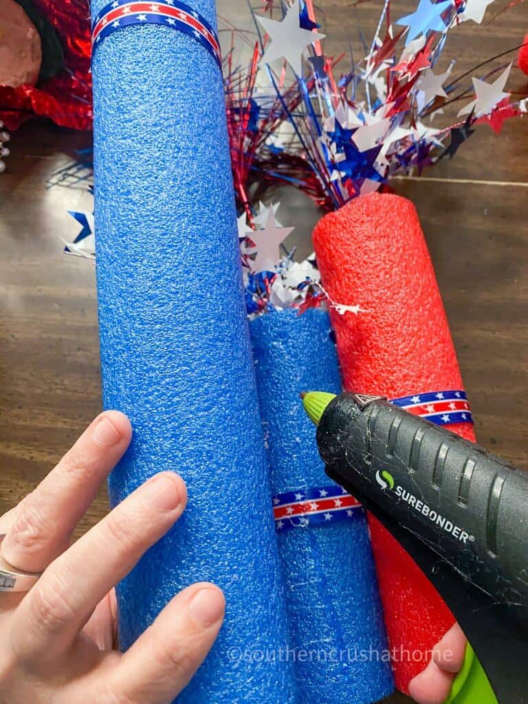 hot glueing embellishments to pool noodles