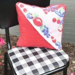 finished thrift store pillow makeover on chair