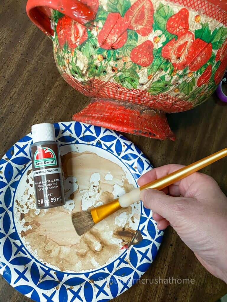 brown paint on paper plate