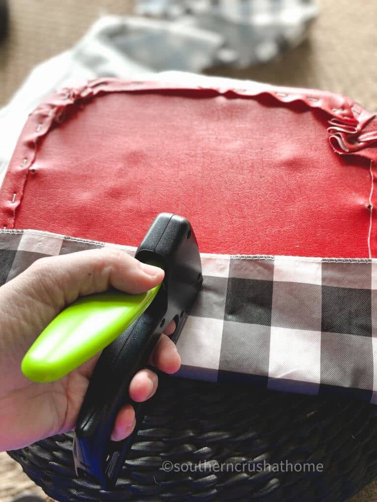 using staple gun to add buffalo plaid fabric