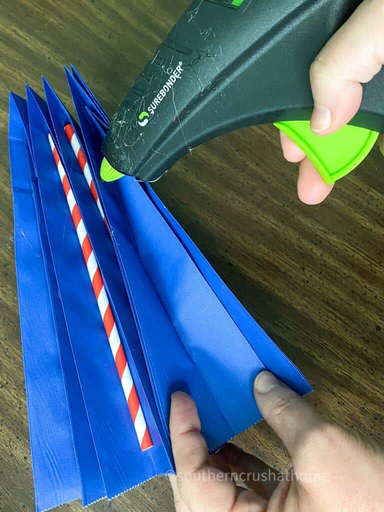 adding straws to dollar tree gift bag