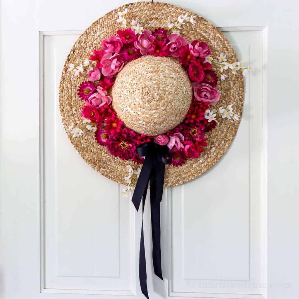 straw wreath hat on door