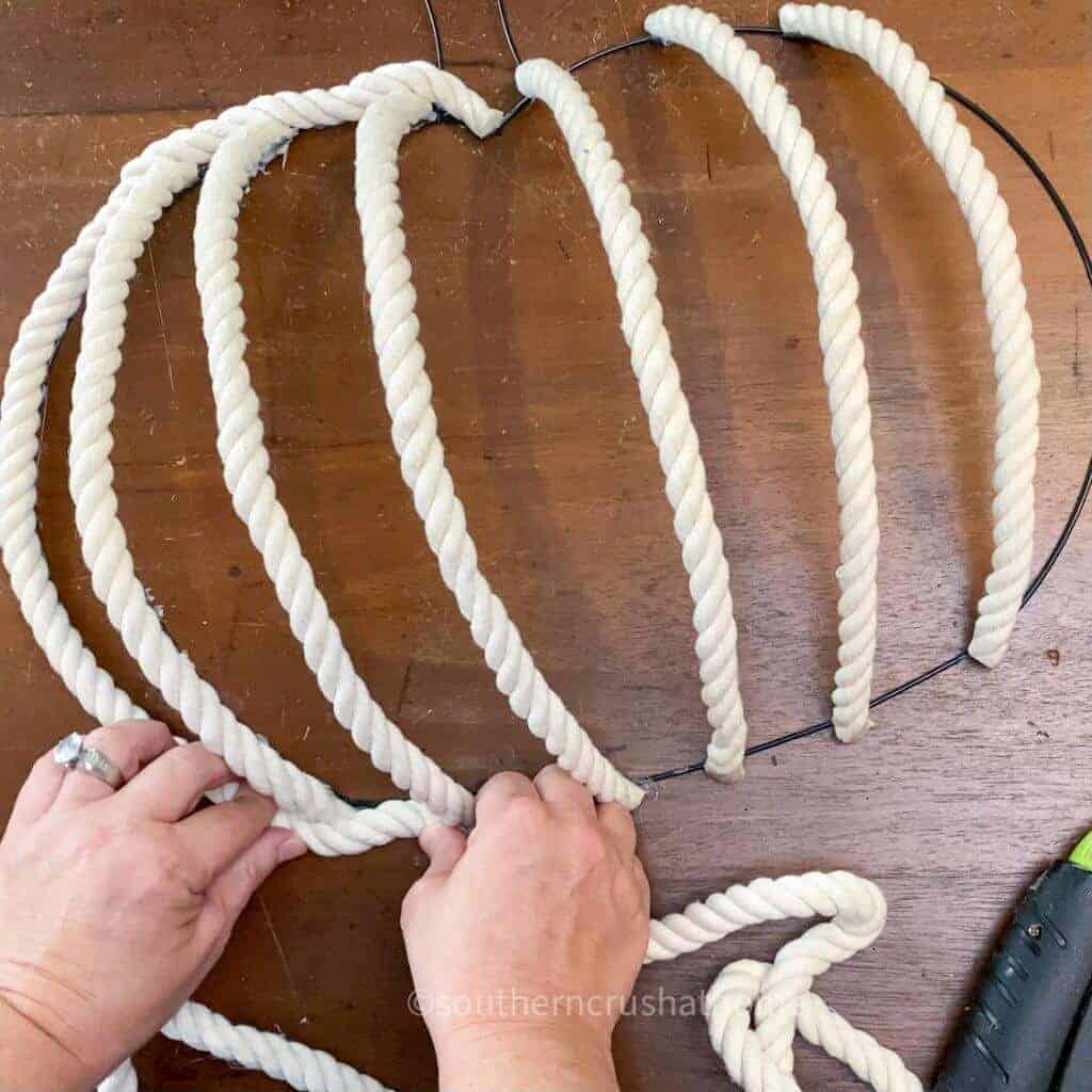 securing rope to bottom of pumpkin form