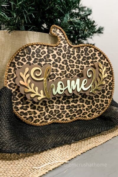 leopard foil pumpkin decor with home sign on table