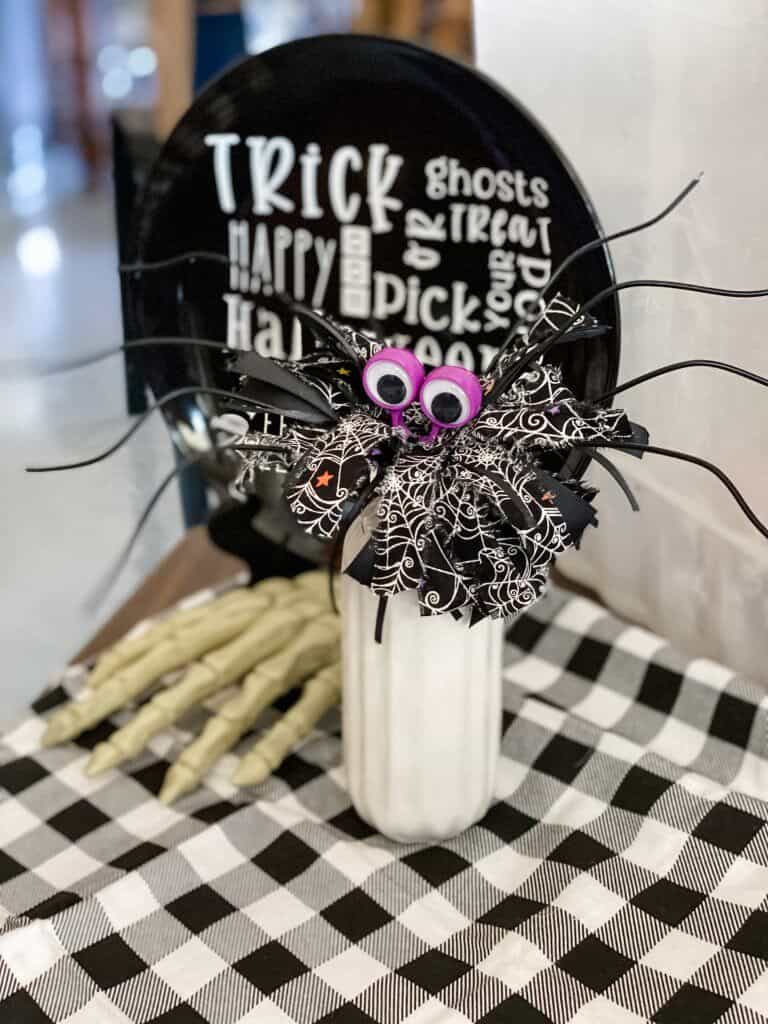 whisk spider on table