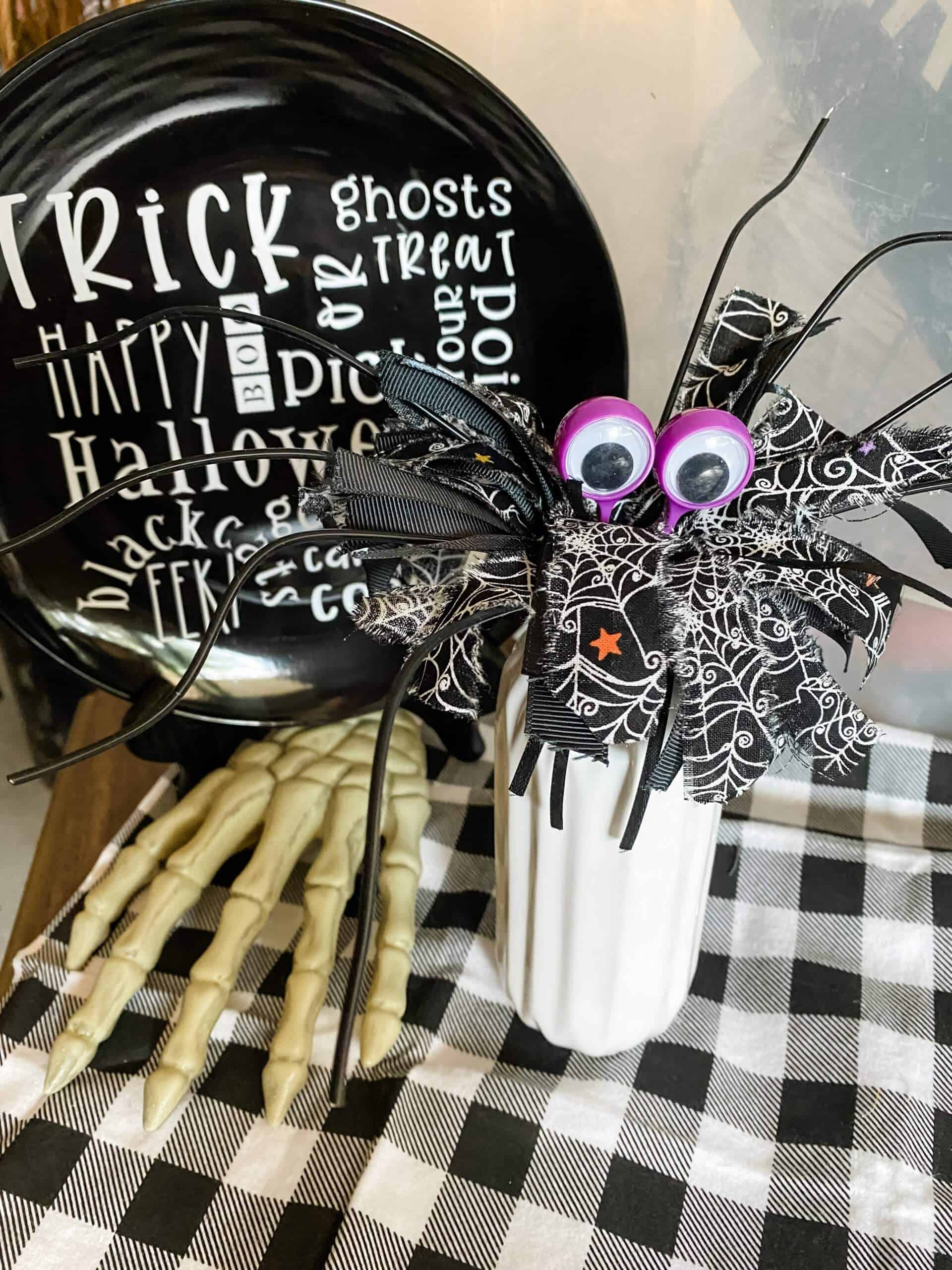 finished Dollar Tree whisk spider on table