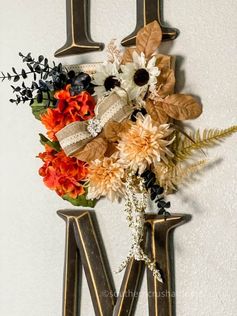 close up of fall foliage on home sign