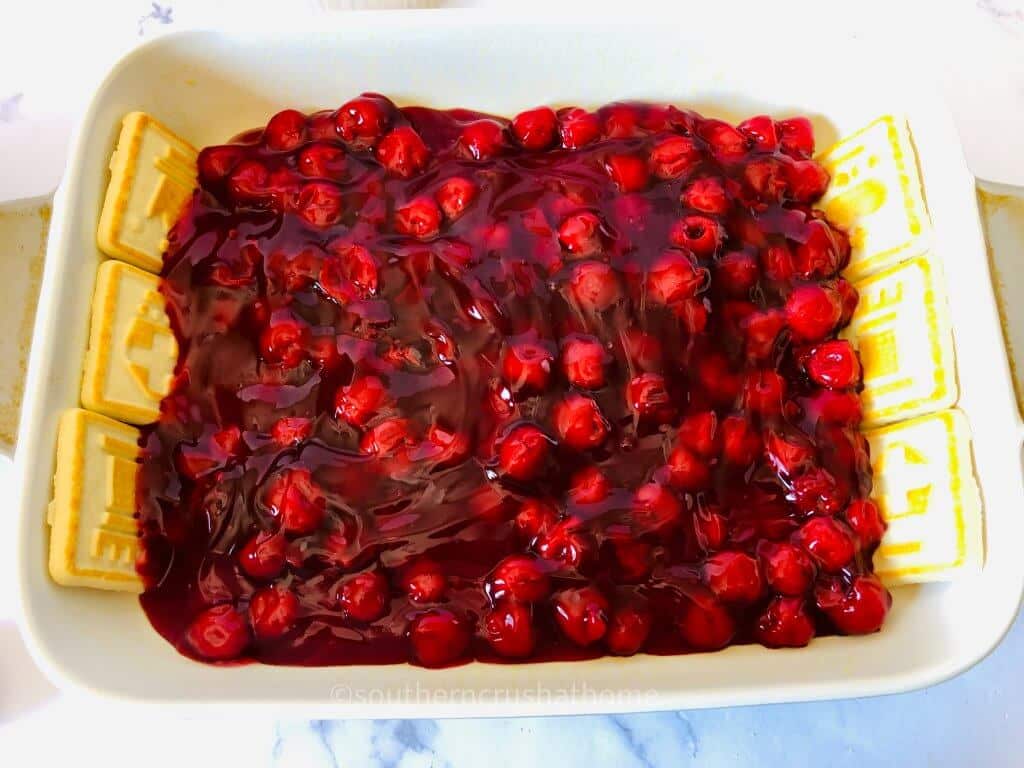 adding cherries to pan