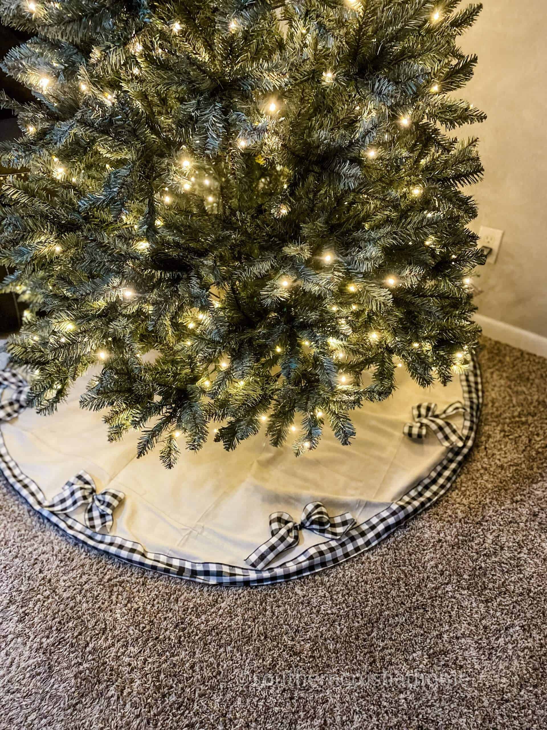 drop cloth tree skirt underneath christmas tree