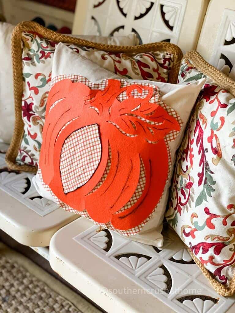 dt pumpkin pillow on bench