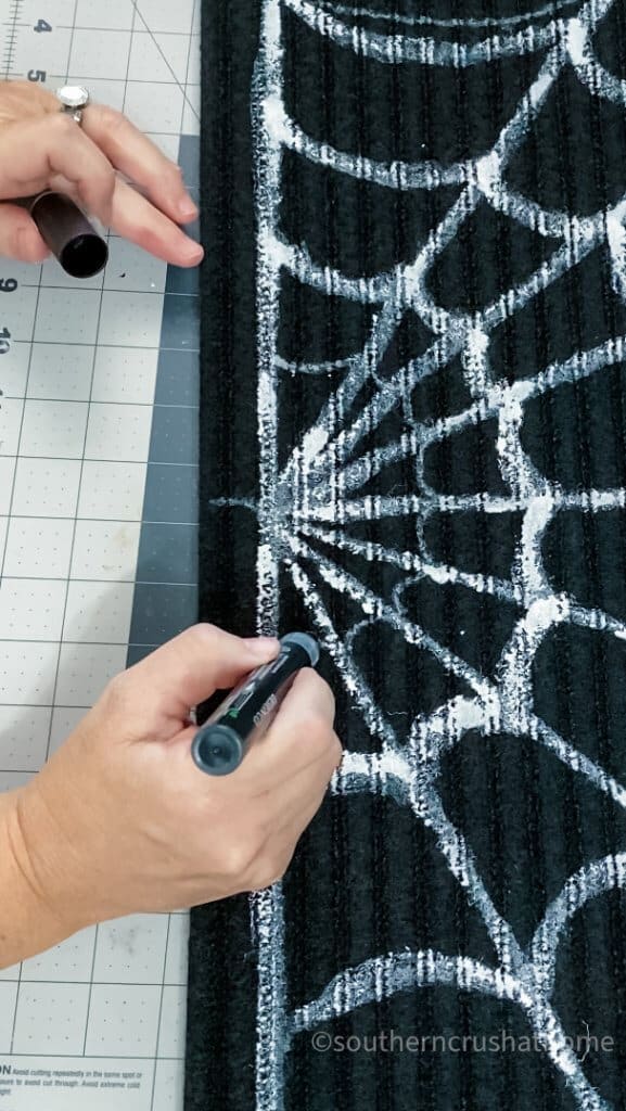 spiderweb doormat with white paint