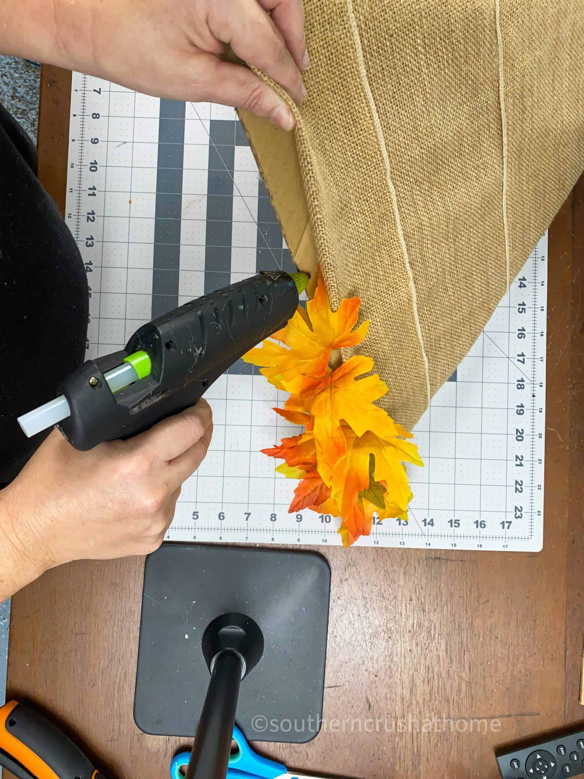 gluing leaves to gnome hat