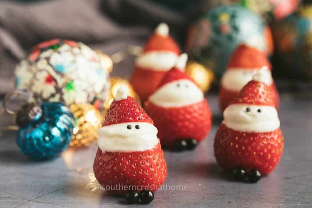 stuffed strawberry santas on counter