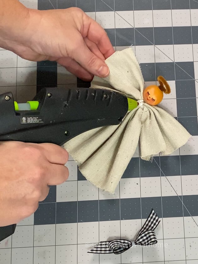 adding hot glue for bow