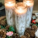 faux birch logs close up lit candles