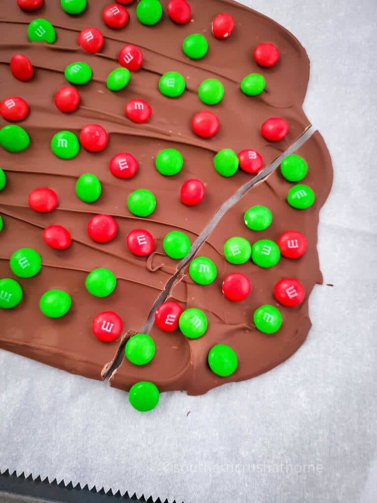 cutting M&M’s Holiday Chocolate Bark