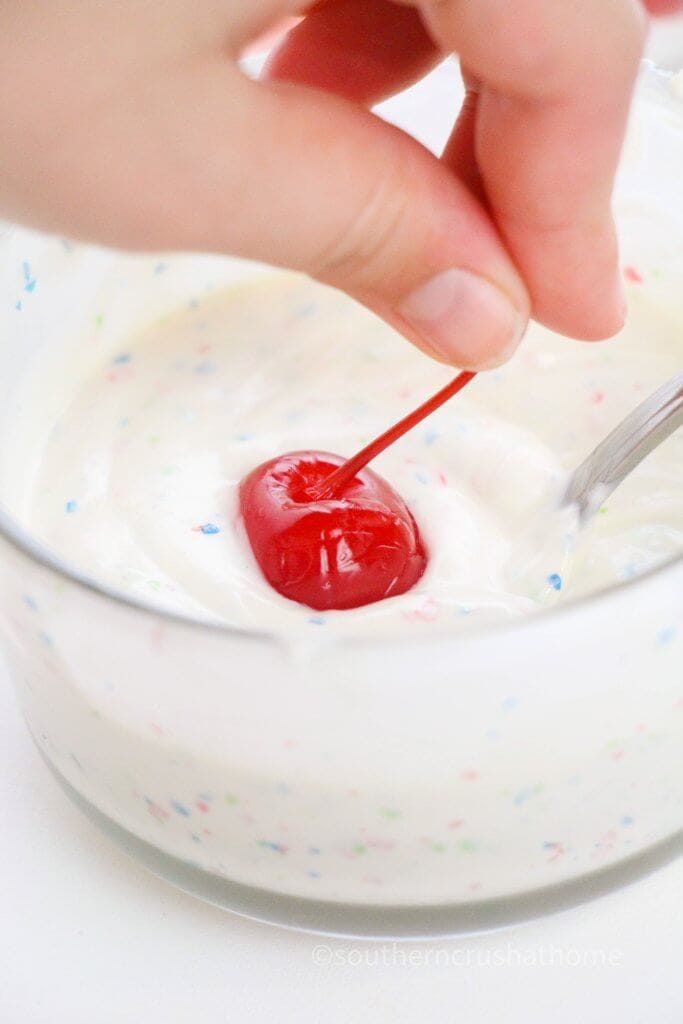 dipping cherries in melted candy