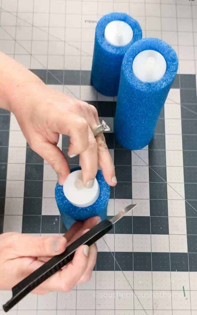 placing candle to check size in pool noodle