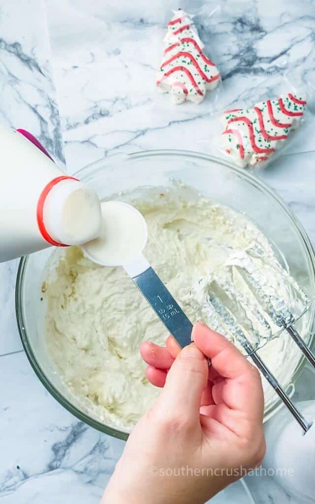 adding milk to christmas dip