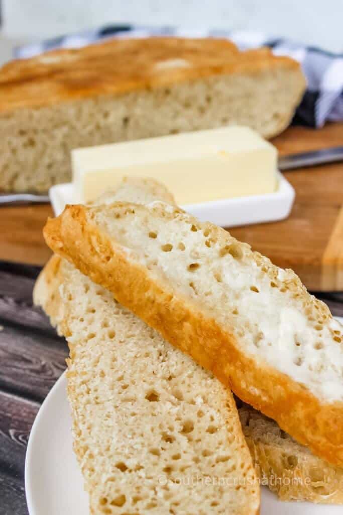 sliced homemade bread with butter