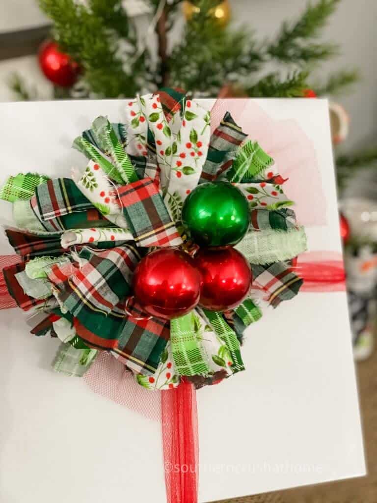 christmas bow with red and green ornaments