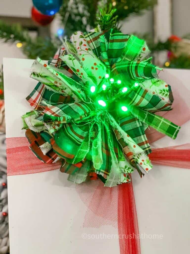 christmas bow with green fairy lights center