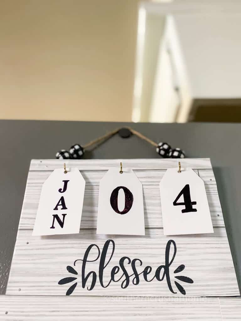 farmhouse calendar on refrigerator