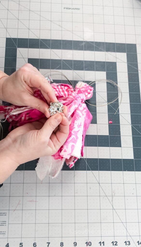 attaching rhinestone to tassel