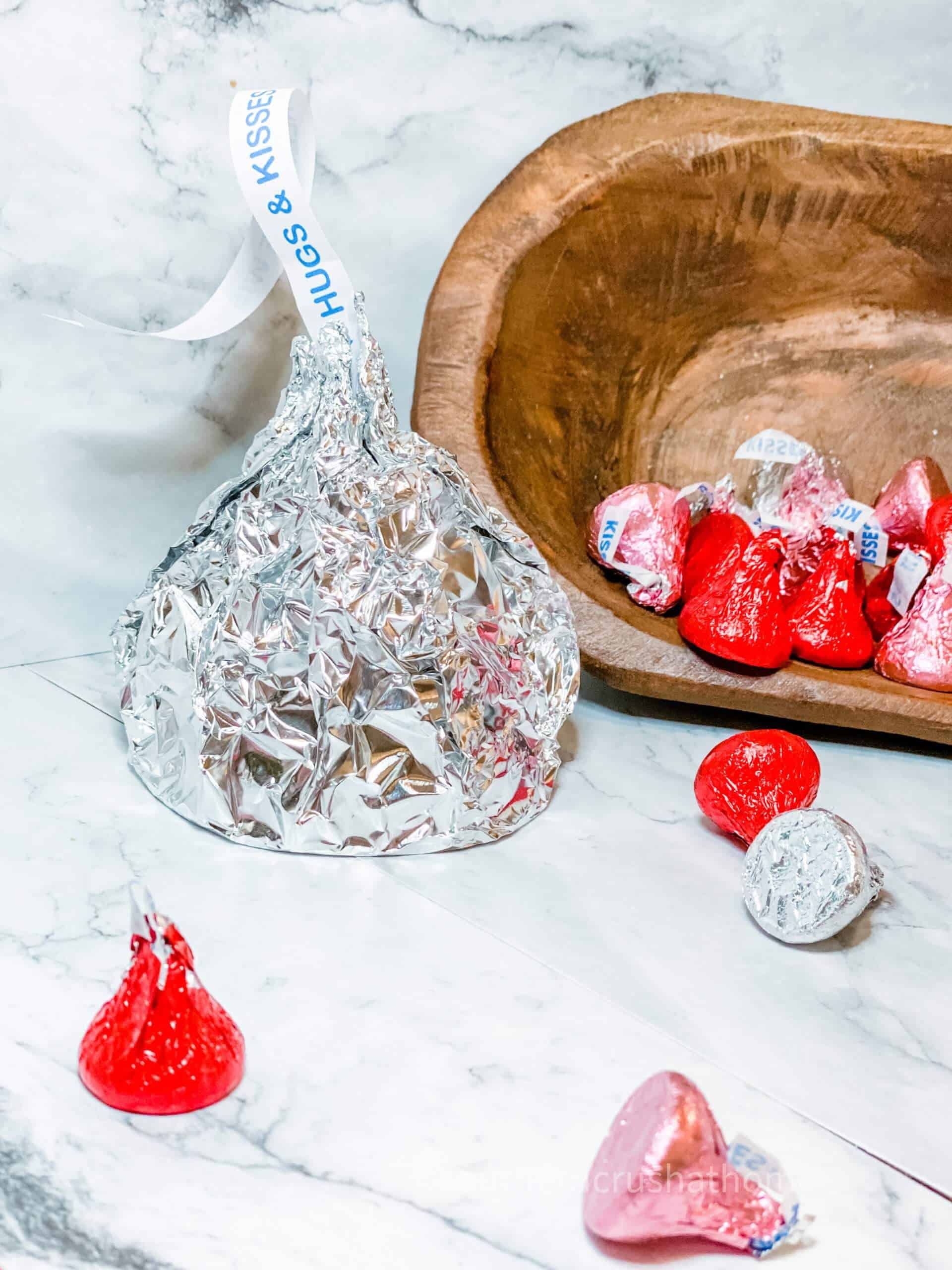 giant hershey kiss on counter next to dough bowl