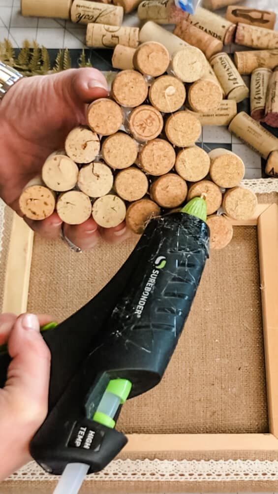 hot gluing back of cork